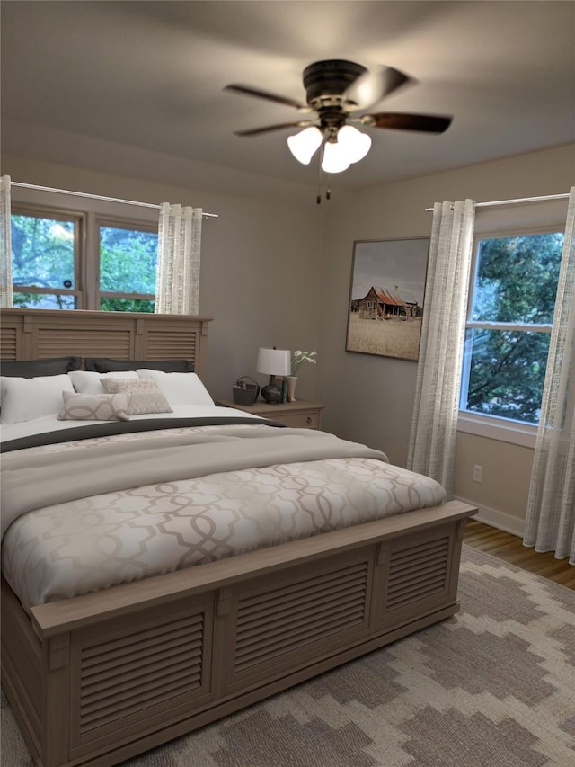 1300 NE 50th Pl, Des Moines, IA 50313 - bedroom featuring light wood finished floors and ceiling fan