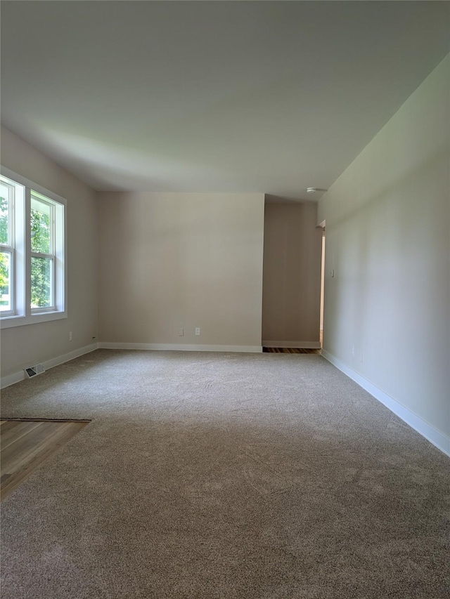 1300 NE 50th Pl, Des Moines, IA 50313 - spare room featuring carpet floors and baseboards
