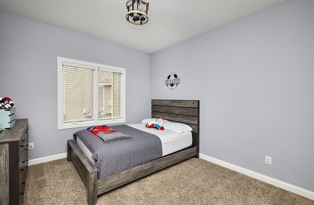 carpeted bedroom with baseboards