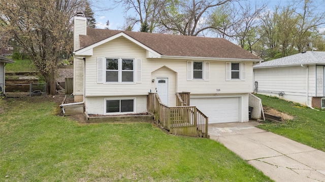 split foyer home featuring roof with shingles, an attached garage, a front lawn, a chimney, and driveway