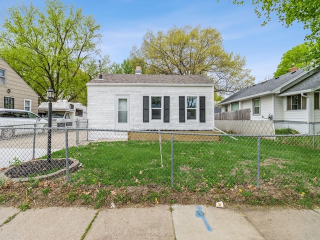 bungalow-style home with fence private yard and a front yard