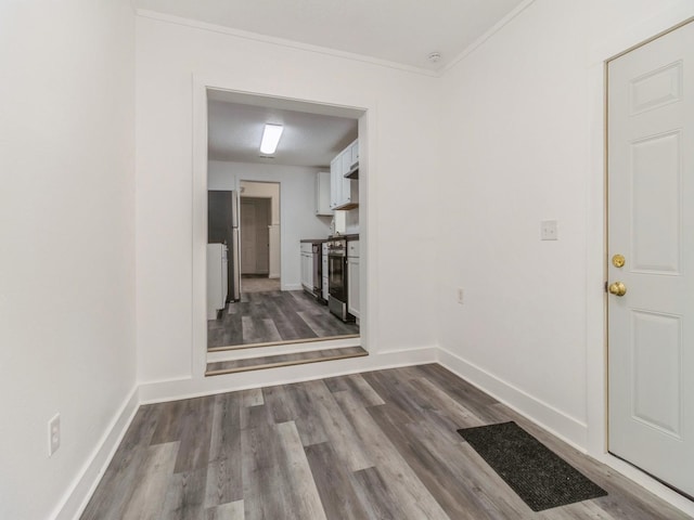 4040 6th Ave, Des Moines, IA 50313 - hallway with dark wood-style flooring, baseboards, and crown molding