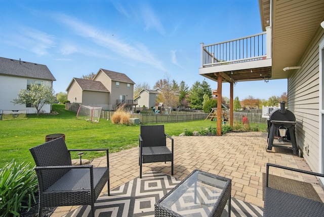 view of patio / terrace with a fenced backyard, grilling area, and a residential view