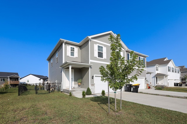 view of front of house with fence, a front yard, concrete driveway, an attached garage, and a residential view