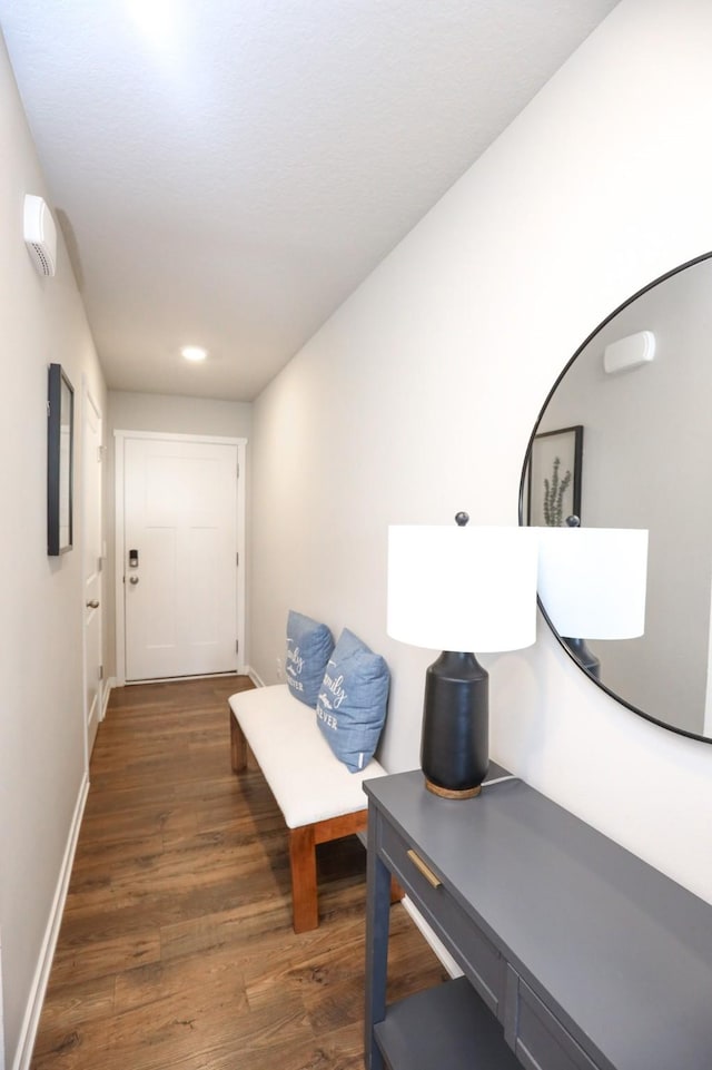 hall with recessed lighting, baseboards, and wood finished floors