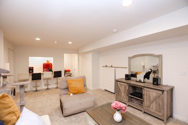 living area featuring baseboards, light carpet, and recessed lighting