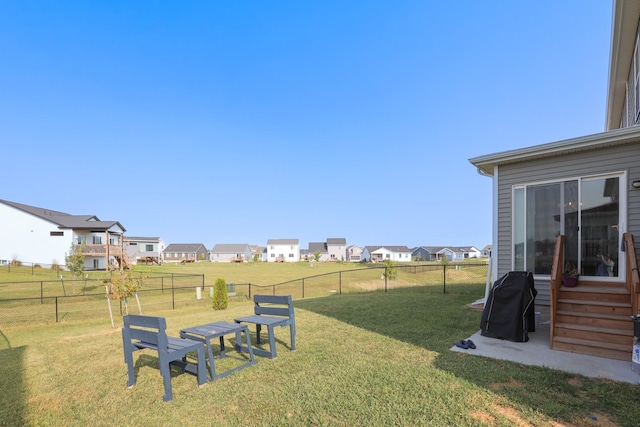 view of yard featuring a residential view and fence