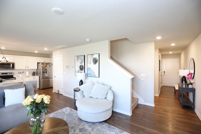 living area featuring stairway, baseboards, recessed lighting, and dark wood-style floors