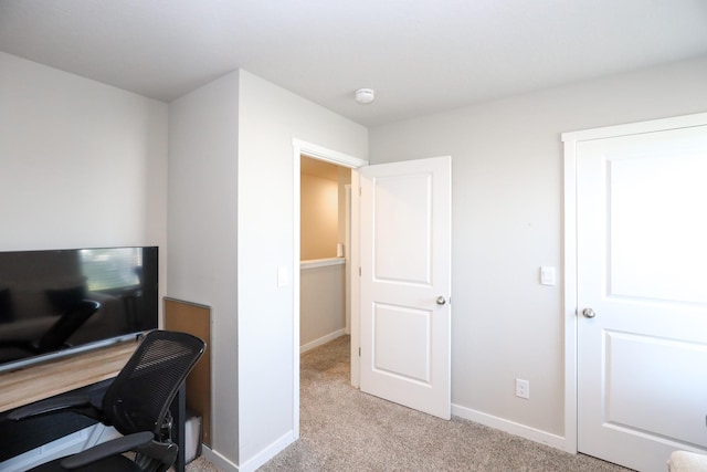 carpeted office with baseboards