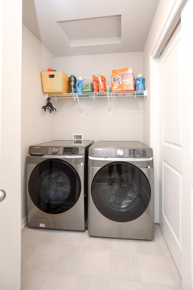 laundry room featuring washer and dryer and laundry area