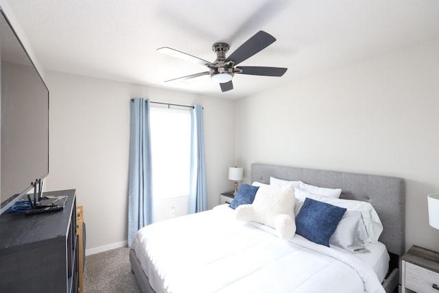 bedroom with carpet floors, a ceiling fan, and baseboards