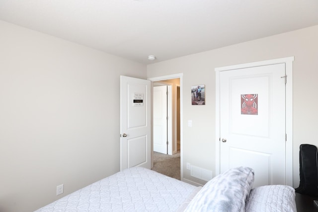 bedroom with carpet flooring and visible vents