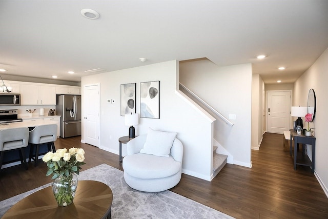 270 NW Charlestown Ln, Waukee, IA 50263 - living area with stairway, dark wood-type flooring, and recessed lighting