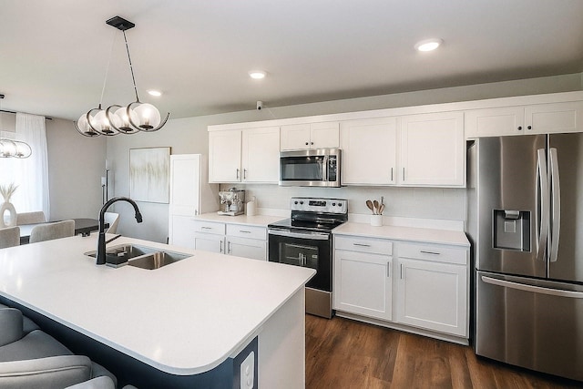270 NW Charlestown Ln, Waukee, IA 50263 - kitchen featuring appliances with stainless steel finishes, a breakfast bar area, white cabinetry, pendant lighting, and recessed lighting