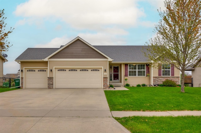 view of front facade featuring a garage, a front lawn, stone siding, roof with shingles, and concrete driveway