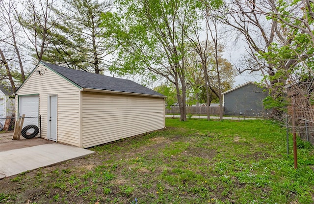 view of yard featuring fence and an outdoor structure