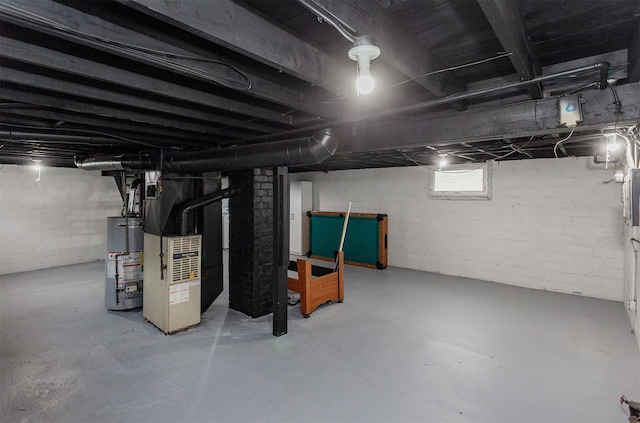 basement featuring heating unit and gas water heater