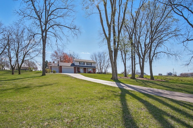 view of front facade featuring a garage and a front lawn