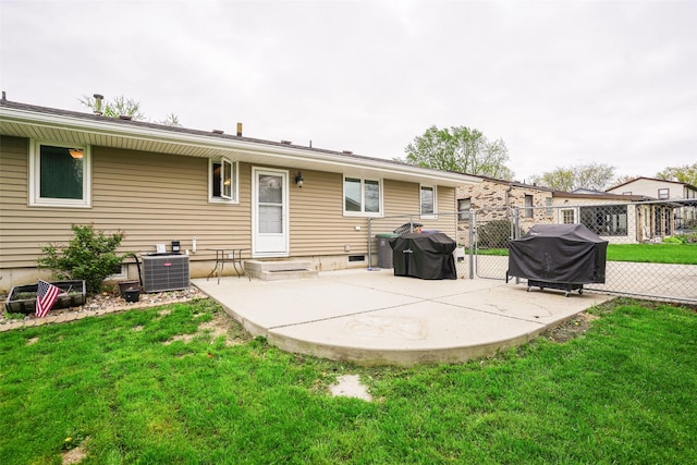 back of property featuring a lawn, a patio area, fence, and cooling unit