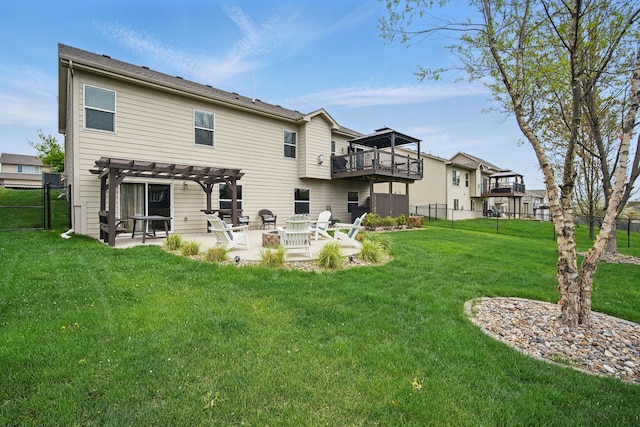 back of property with a fenced backyard, a pergola, a yard, and a patio
