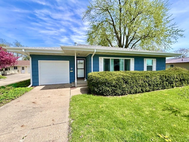 ranch-style home with an attached garage, a front lawn, and concrete driveway