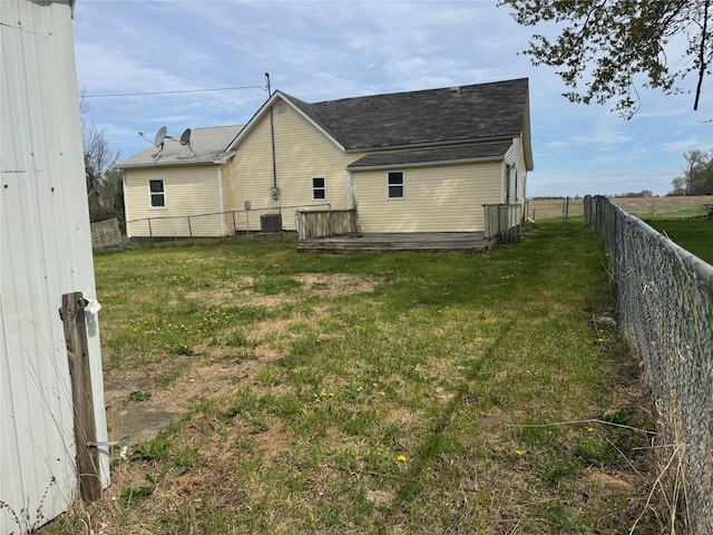 706 5th St, Lorimor, IA 50149 - view of home's exterior featuring a yard, a fenced backyard, and central air condition unit