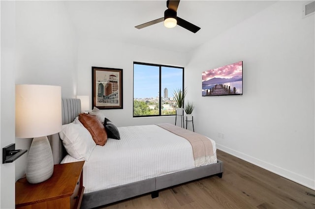 508 Indianola Rd Unit 1, Des Moines, IA 50315 - bedroom featuring baseboards, ceiling fan, wood finished floors, and visible vents