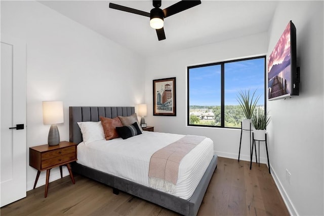 508 Indianola Rd Unit 1, Des Moines, IA 50315 - bedroom featuring baseboards, a ceiling fan, and wood finished floors