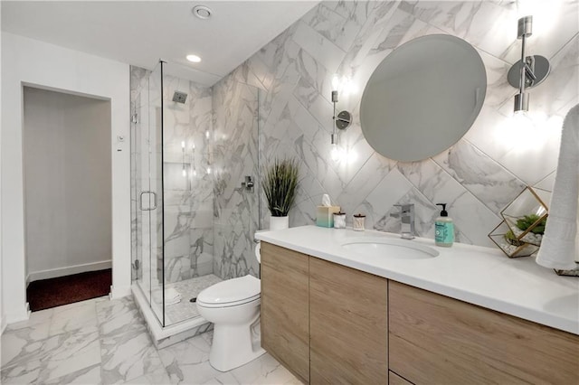 508 Indianola Rd Unit 1, Des Moines, IA 50315 - bathroom featuring vanity, toilet, a marble finish shower, marble finish floor, and recessed lighting