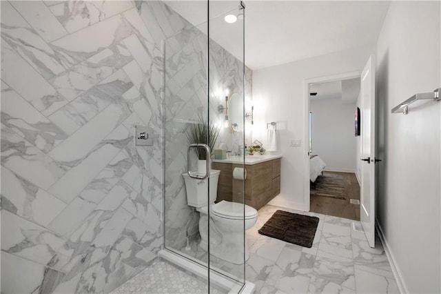 508 Indianola Rd Unit 1, Des Moines, IA 50315 - ensuite bathroom with vanity, marble finish floor, a marble finish shower, and toilet