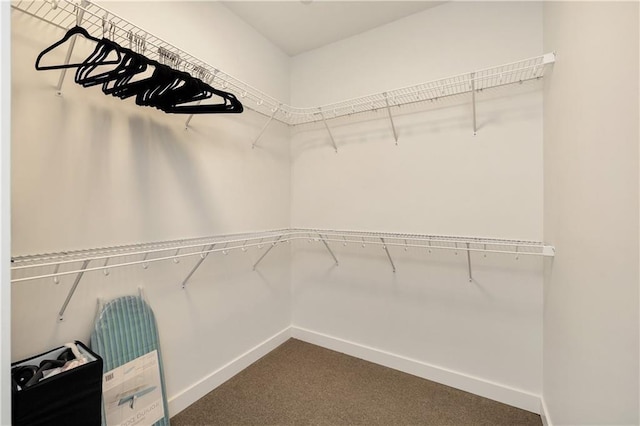 508 Indianola Rd Unit 1, Des Moines, IA 50315 - walk in closet featuring dark carpet