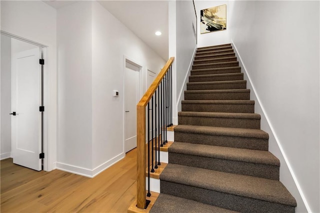 508 Indianola Rd Unit 1, Des Moines, IA 50315 - stairway with recessed lighting, baseboards, and wood finished floors