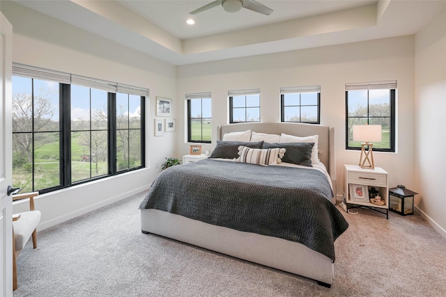 bedroom featuring carpet flooring, recessed lighting, baseboards, and a raised ceiling