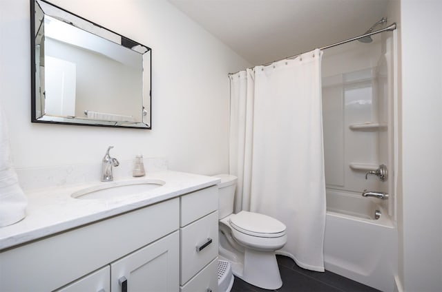 full bathroom featuring tile patterned floors, shower / bath combo, vanity, and toilet