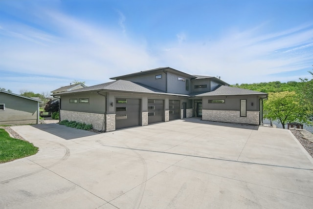 4159 Panorama Dr, Panora, IA 50216 - prairie-style house featuring concrete driveway and stone siding