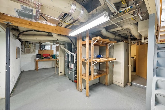 4714 Douglas Ave, Des Moines, IA 50310 - basement featuring heating unit and washer / dryer