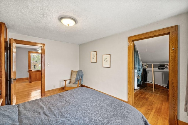 4714 Douglas Ave, Des Moines, IA 50310 - bedroom with baseboards, attic access, a textured ceiling, and wood finished floors