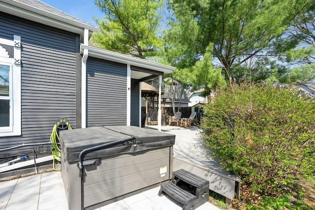 view of patio / terrace with a hot tub