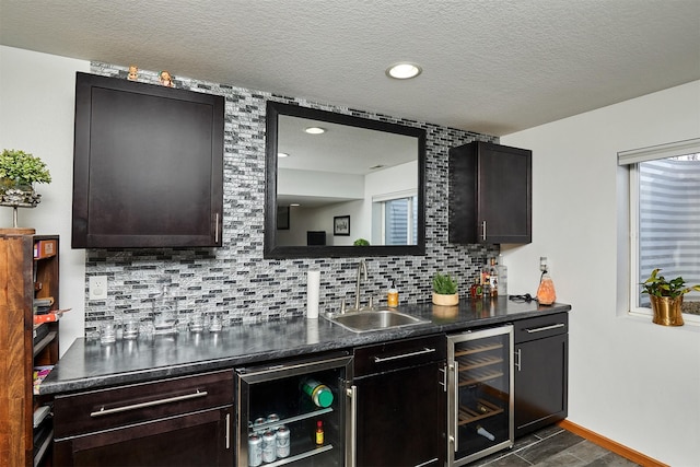 520 SE Murphy Dr, Waukee, IA 50263 - bar with a sink, tasteful backsplash, indoor wet bar, and wine cooler