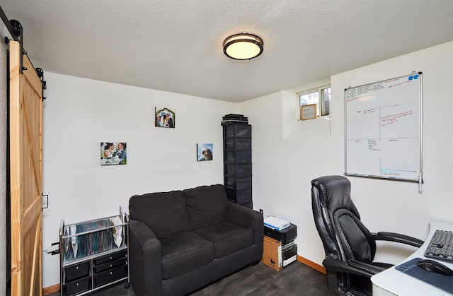 520 SE Murphy Dr, Waukee, IA 50263 - office space featuring baseboards, a barn door, and dark wood-style flooring