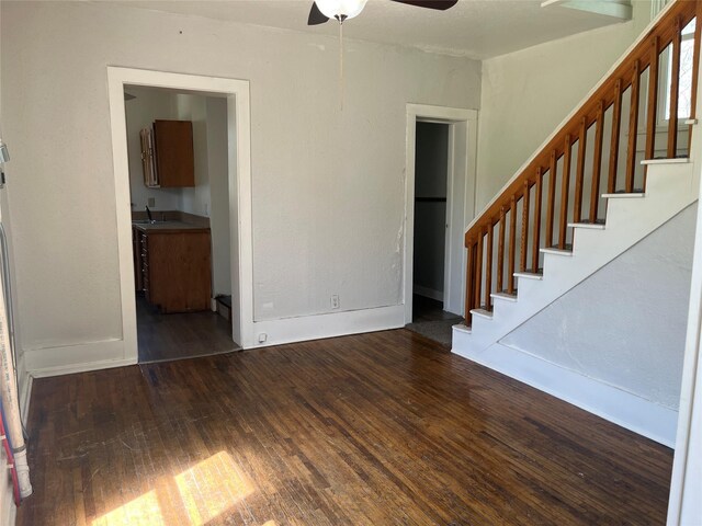 2104 23rd St, Des Moines, IA 50310 - unfurnished living room featuring stairway, a ceiling fan, hardwood / wood-style floors, and a sink