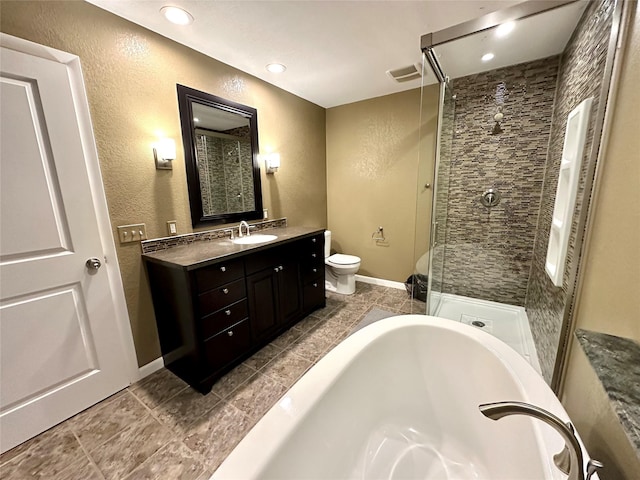 full bathroom with a bathtub, visible vents, a stall shower, vanity, and toilet