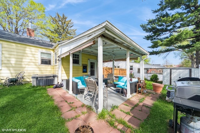 view of patio / terrace featuring fence and an outdoor hangout area