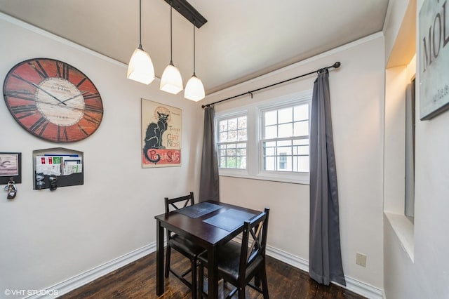 dining area with baseboards, dark wood finished floors, and ornamental molding