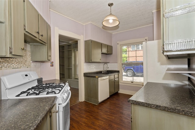 kitchen featuring dark countertops, white appliances, dark wood finished floors, tasteful backsplash, and ornamental molding