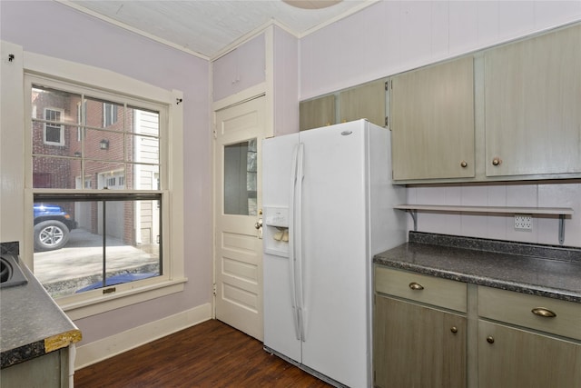 kitchen featuring baseboards, dark countertops, dark wood-style flooring, and white fridge with ice dispenser