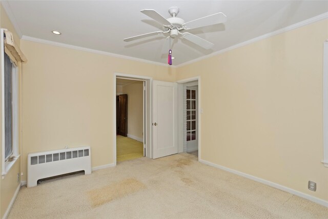 5502 Ingersoll Ave, Des Moines, IA 50312 - carpeted spare room with crown molding, radiator, a ceiling fan, baseboards, and recessed lighting