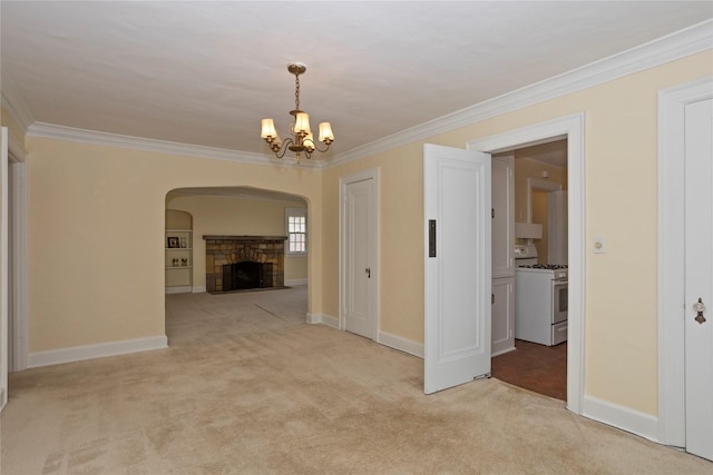 5502 Ingersoll Ave, Des Moines, IA 50312 - interior space with light carpet, arched walkways, a chandelier, baseboards, and ornamental molding