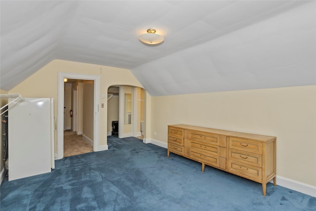 5502 Ingersoll Ave, Des Moines, IA 50312 - bonus room with baseboards, carpet flooring, arched walkways, and lofted ceiling