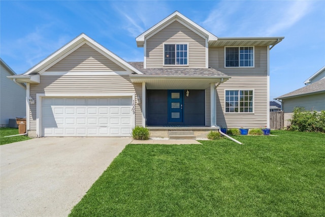1009 SE 5th St, Grimes, IA 50111 - view of front facade with driveway, a garage, and roof with shingles
